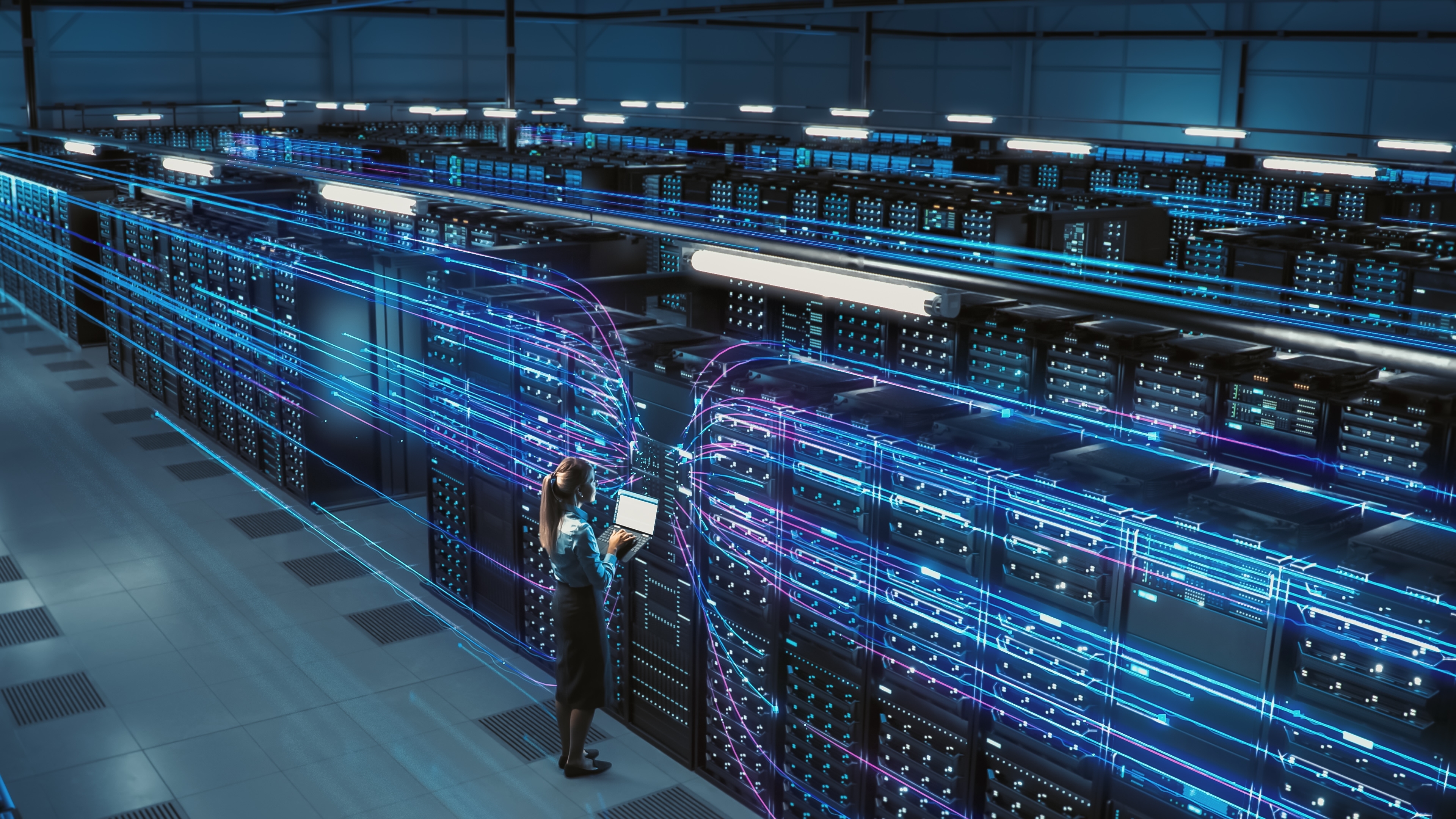 Big data center with a female Chief Technology Officer overseeing operations.